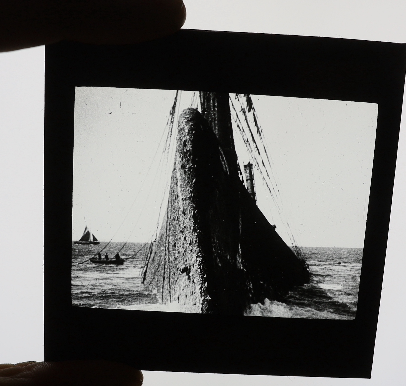 A collection of Magic Lantern boxed slides and quarter plate negatives, shipping and naval recovery